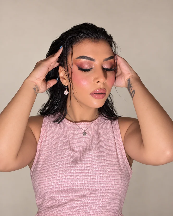 Rose-toned occasion makeup with shimmering eyelids and glossy lips