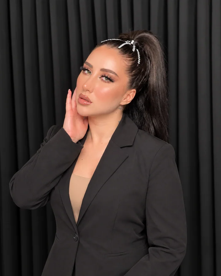 Occasion makeup with a high ponytail and silver hair accessory